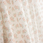 Popeline de algodão com padrão floral pequeno em coral - Ribes y Casals