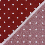 Lona estampada com bolinhas brancas sobre fundo granada - Ribes y Casals