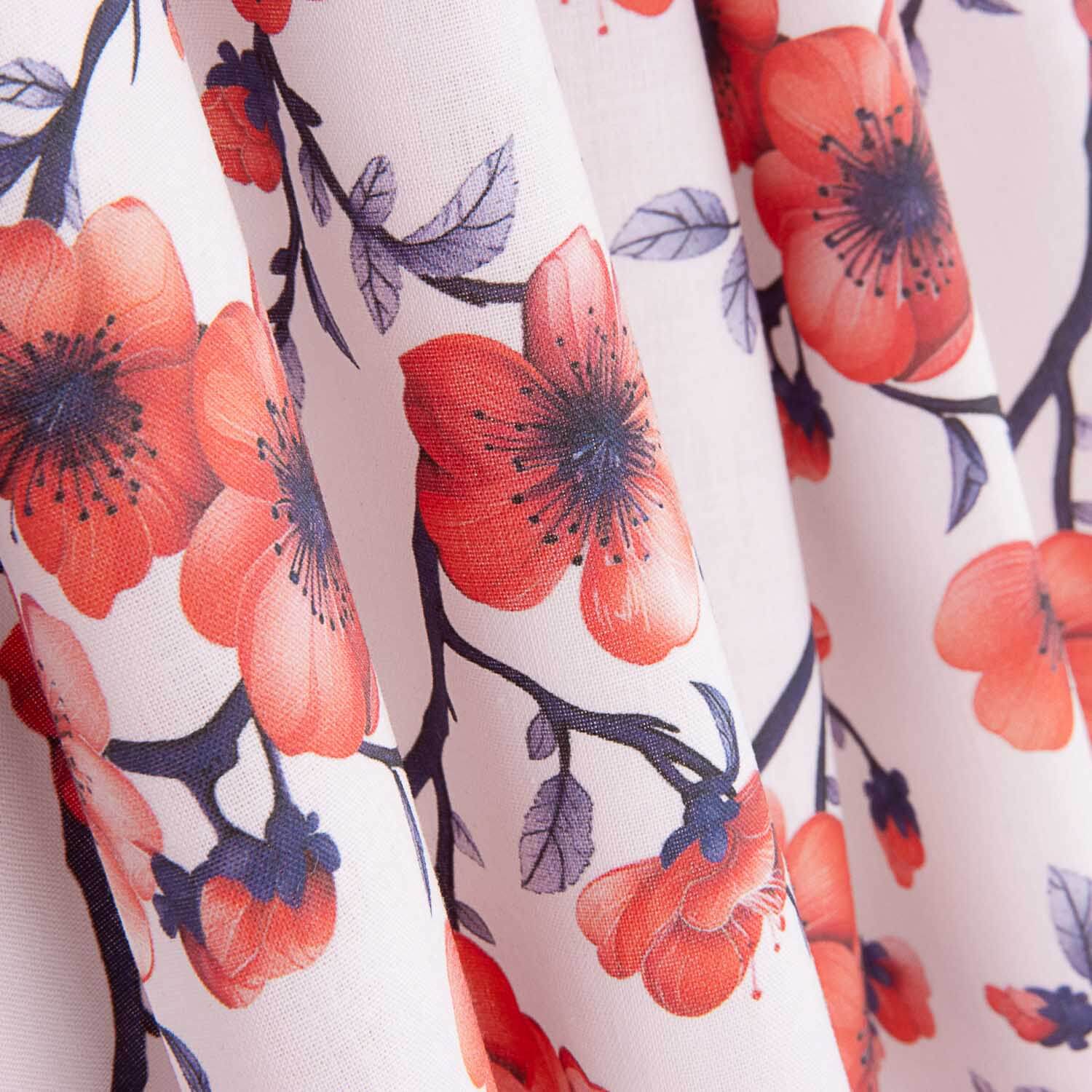Popeline de algodão estampado com ramos de sakura coral - Ribes y Casals