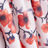 Popeline de algodão estampado com ramos de sakura coral - Ribes y Casals