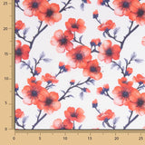 Popeline de algodão estampado com ramos de sakura coral - Ribes y Casals