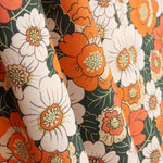 Popeline de algodão estampado com flores retro laranja - Ribes y Casals