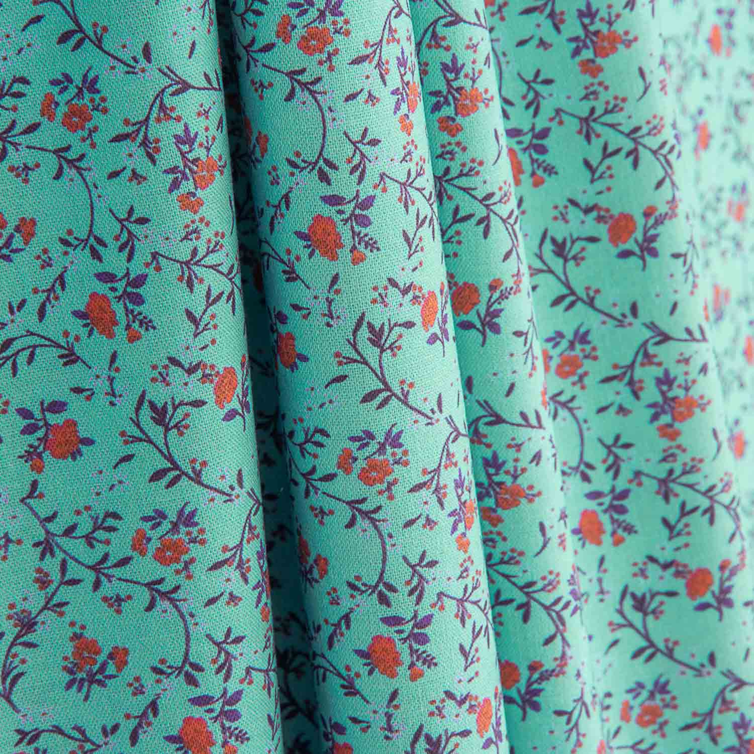 Popeline de algodão estampado com mini flores turquesa - Ribes y Casals