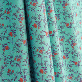 Popeline de algodão estampado com mini flores turquesa - Ribes y Casals