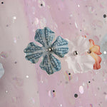 Tule «Jardim das Fadas» em malva com flores 3D e lamé prateado - Ribes y Casals
