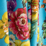 Viscose estampada com flores de jardim turquesa - Ribes y Casals