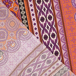 Viscose estampada com motivos étnicos, riscas em laranja e roxo - Ribes y Casals