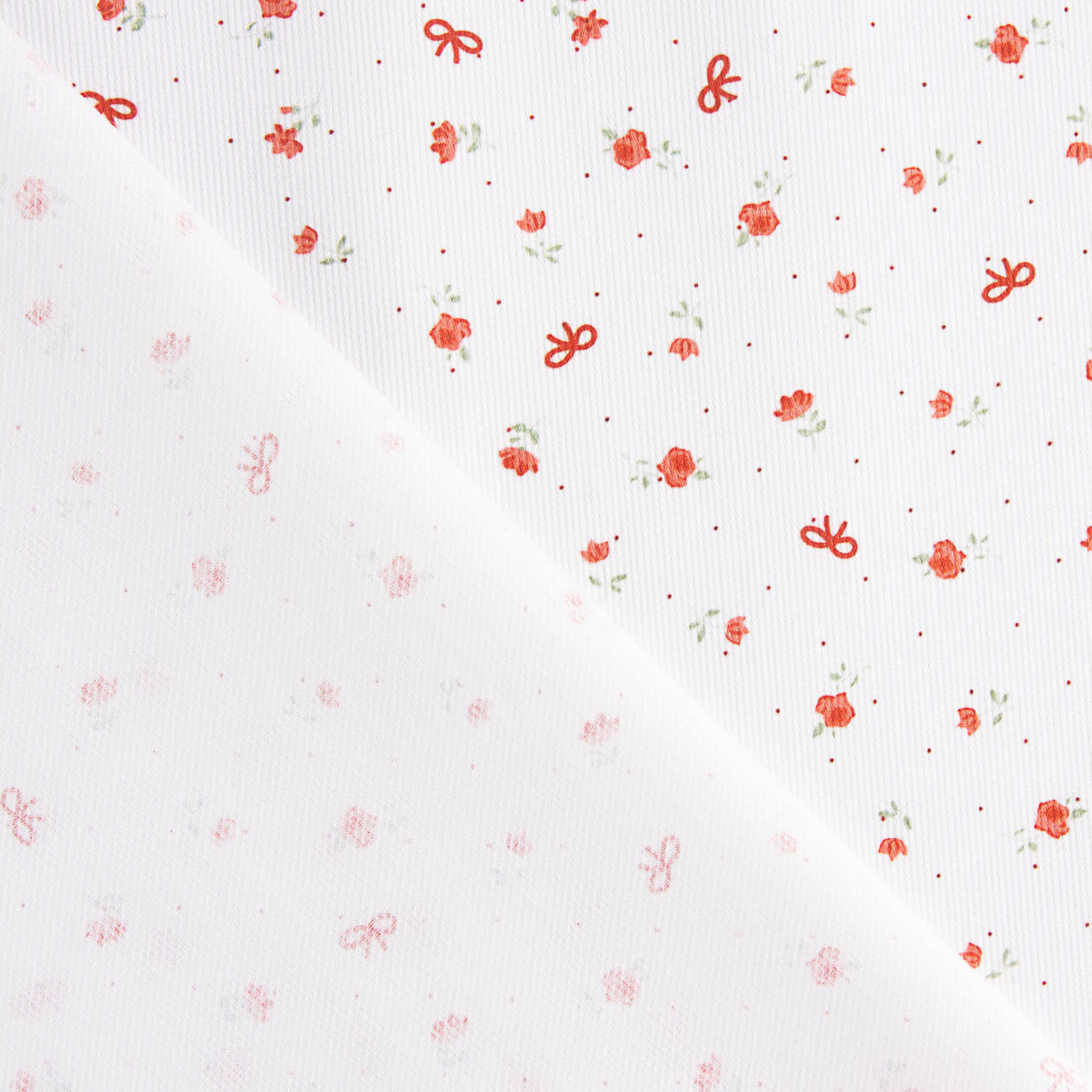 Piqué de algodão com mini flores e laços - Ribes y Casals