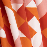 Viscose estampada com motivos geométricos em laranja e coral - Ribes y Casals