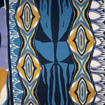 Viscose estampada com motivos geométricos em azul e mostarda - Ribes y Casals