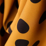 Tecido de Sarja Elástica Círculos Amarelo - Ribes y Casals